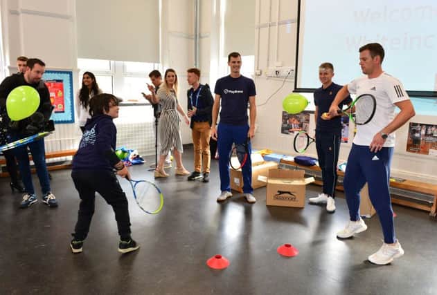 Jamie Murray, Leon Smith and Aidan McHugh attend a LTA Tennis Clinic at Whiteinch Primary School on day one of The Murray Trophy at Scotstoun Leisure Centre. Pic: Mark Runnacles/Getty Images for LTA