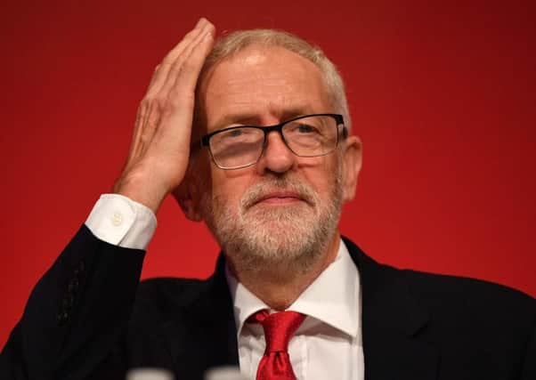 Labour Party leader Jeremy Corbyn gestures on stage at the Labour party conference in Brighton. Picture: Getty Images