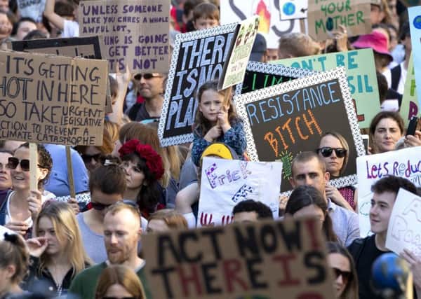 Youngsters march through Edinburgh during Friday's climate strike. Picture: PA