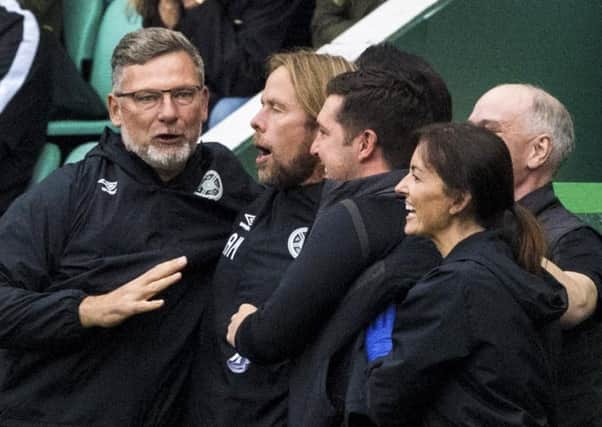 Hearts manager Craig Levein celebrates with his staff at Easter Road