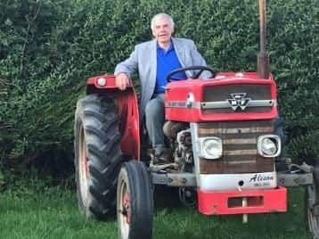 Stan Weir on one of his beloved tractors. Picture: Stan Weir.