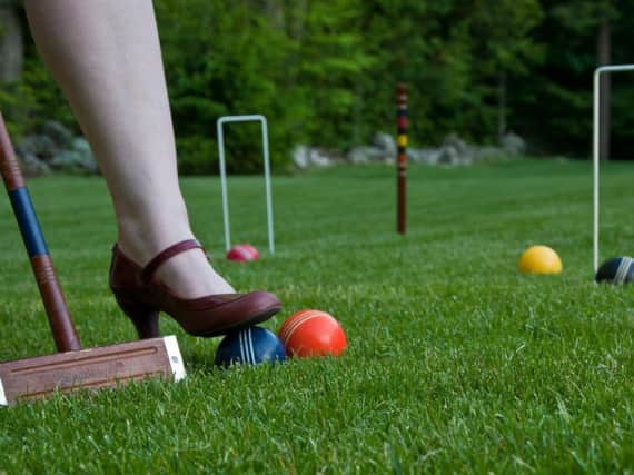 Visitors to the Meadows Croquet Club can have a go themselves. Picture: James Lee.