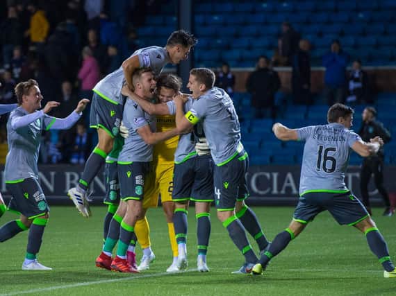 The Hibs players celebrate their 5-4 penalty shootout win over Kilmarnock. Picture: SNS