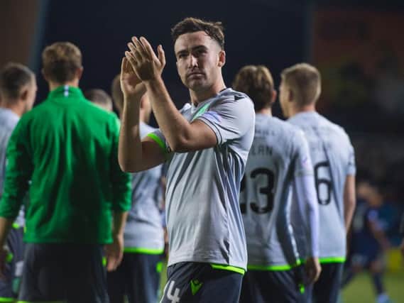 Stevie Mallan applauds the 727 Hibs fans who made the trip to Rugby Park. Picture: SNS