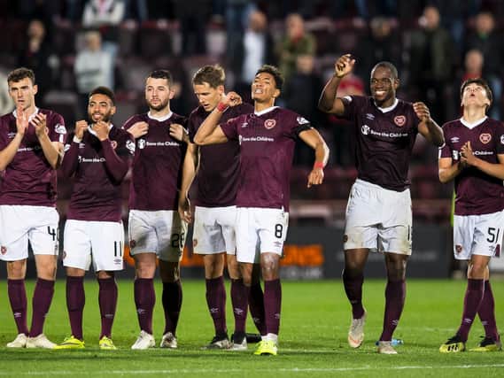 The Hearts players celebrate during the penalty shoot-out win over Aberdeen. Picture: SNS