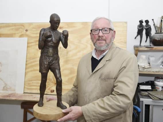 Alan Herriot with the maquette of Ken Buchanan's statue. Picture: Jon Savage.