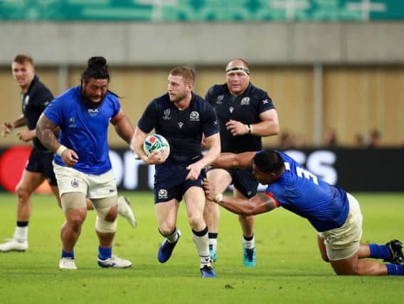 Finn Russell probes at the Samoan defence during Scotland's 34-0 win in Kobe. Picture: Getty Images