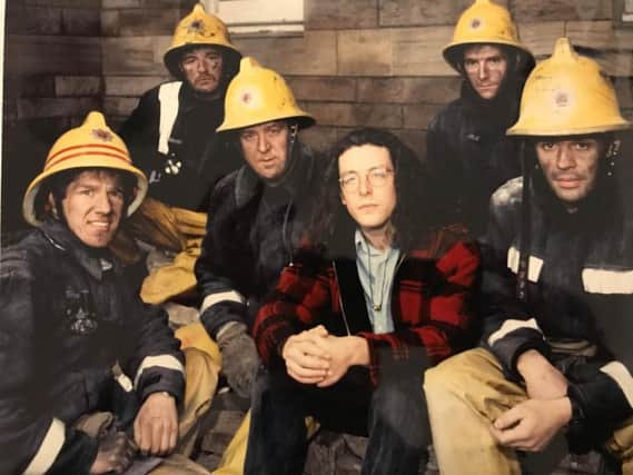 Martin Baptie in 1990, with firemen who rescued him the year before.