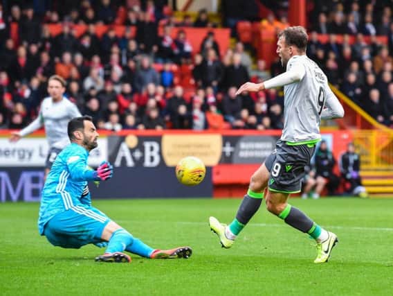 Hibs striker Christian Doidge was denied on more than one occasion by goalkeeper Joe Lewis. Picture: SNS