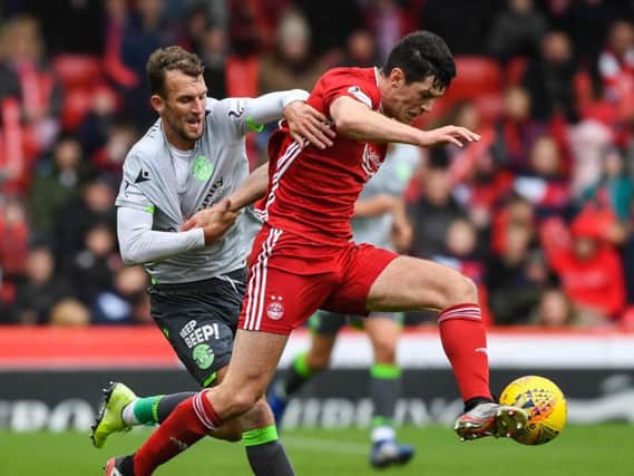 Hibs striker Christian Doidge endured a tough afternoon at Pittodrie after missing three clear-cut chances to score. Picture: SNS