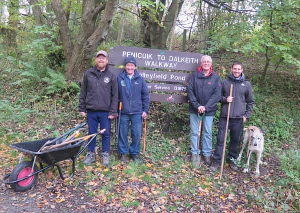 Volunteers on the Penicuik to Dalkeith walking and cycle path. The picture shows, from left to right: Ranger Alan Krumholds and volunteers, Arthur McKenzie, Dougie Burton, Miguel Paredes Bandres and Fleck, the dog.