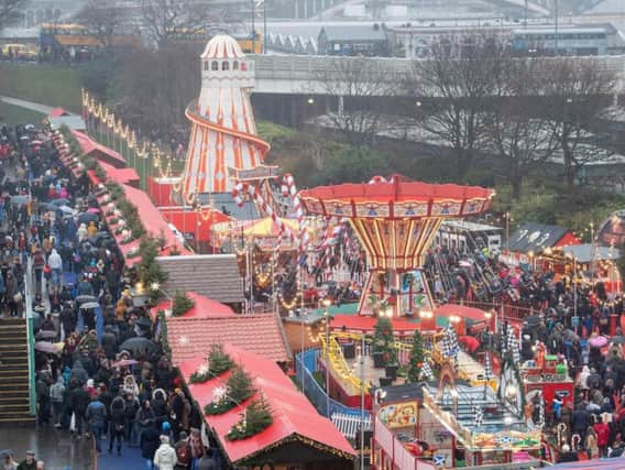 Edinburgh's Chrismas market and fairground can attract up to 100,000 festive revellers. PIC: TSPL.
