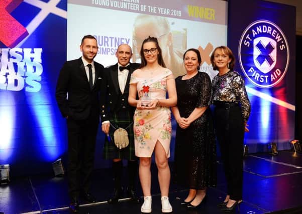 Gorebridge teen, Courtney Simpson was recognised at the Scottish First Aid Awards for outstanding contribution to first aid. Pictured: David Farrell, Yvonne Goodfellow (Scotmid), Leigh and Richard Allan and Courtney Simpson.