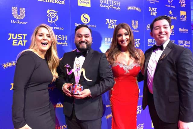 Apprentice candidates (Left to right) Pamela Laird, Jamelin Artegas and Ryan-Mark Parson, with Habibur Khan from the Radhuni in Loanhead, with his British Curry Award.