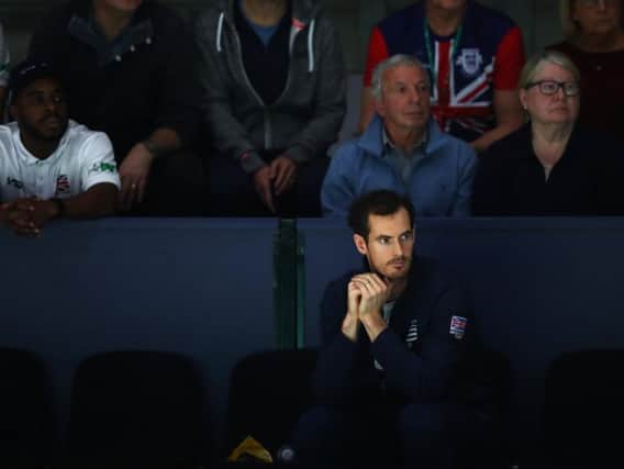 Andy Murray looks on during the Davis Cup tournament in Madrid. The Scot is hopeful of playing at Wimbledon next year