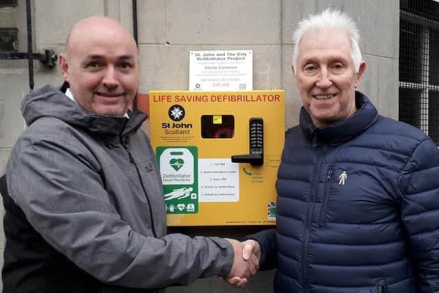 Defibrillator donor Colin Mackay,right, and friend Stevie Cameron.