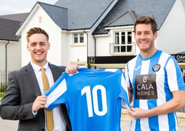 Belwood Oaks Sales Advisor Blair Dickson and Penicuik Athletic captain Aaron somerville.
 CALA Homes has sponsored the local team for 10 years in a row.